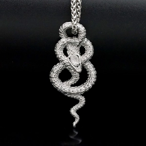 Silver stainless steel snake pendant necklace with detailed scales and wheat chain link