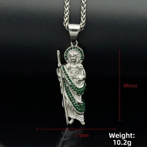 Macro detail of silver Saint Jude pendant with green crystals on wheat chain
