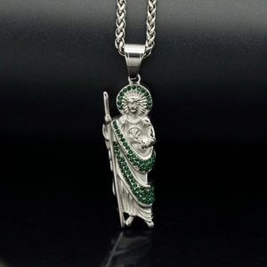 Saint Jude pendant necklace in stainless steel with green rhinestones on black background