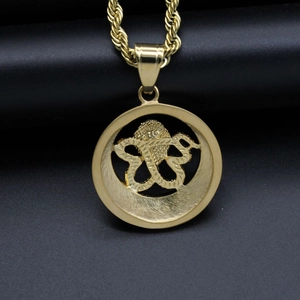 Vintage gold round pendant necklace featuring twin snake relief and twisted rope chain