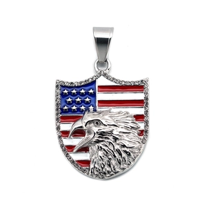 Detailed view of hip hop shield pendant with American flag, eagle head, and crystals