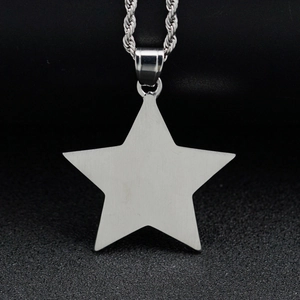 Close-up of silver star pendant with brushed metal texture on stainless steel rope chain