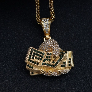 Gold hip hop fist holding money pendant necklace with sparkling diamonds and Cuban chain