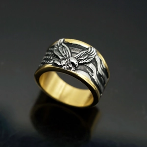 Two-tone gold and silver stainless steel eagle ring with engraved stripe patterns