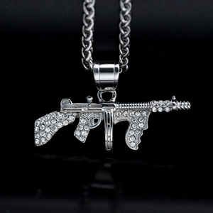Hip hop style gold-plated stainless steel machine gun pendant with sparkling crystals