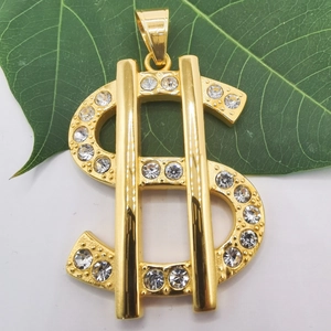 Macro detail of gold-plated dollar sign pendant with sparkling rhinestones on leaf