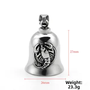 Detail shot of stainless steel bell pendant with scorpion relief and measurement specs