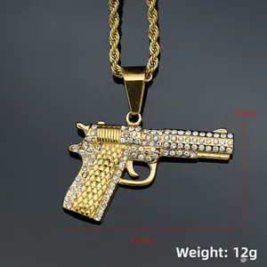 Detail view of 49mm gold pistol pendant with white rhinestones and dimensions shown