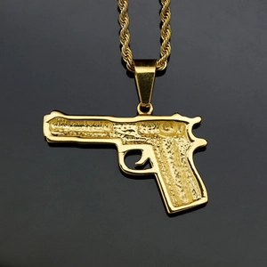 Gold-plated handgun pendant with detailed texture on a twisted rope chain necklace