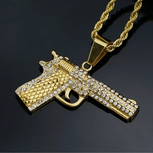 Hip hop gold plated pistol pendant necklace with white crystals on a rope chain