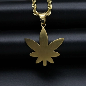 Hip-hop gold plated maple leaf pendant necklace with twist rope chain on black background