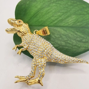 Gold plated hip hop Tyrannosaurus Rex pendant with iced out rhinestones on green leaf