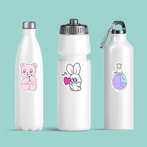 Detailed view of three white water bottles featuring cute cartoon stickers on a teal background