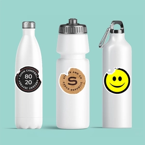 Detail showing waterproof cartoon stickers applied on white stainless steel sport bottles