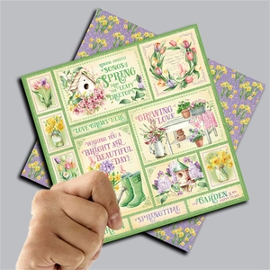 Detail of vintage garden-themed scrapbooking paper with spring floral illustrations