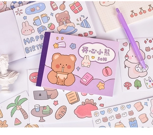Detailed view of Happy Bear stickers with purple cartoon patterns and gift packaging