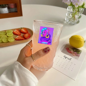 Glacier texture glass cup with cyberpunk anime stickers and neon design in lifestyle scene