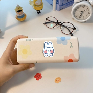 Cute cream-colored glasses case featuring a minimalist bunny and flower illustration