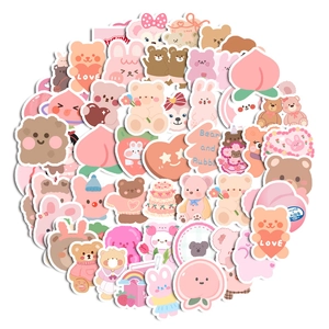 Close-up of waterproof cartoon bear and rabbit stickers for stationery and scrapbooking