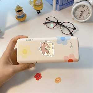 Cute cartoon bear and flower pattern cream hard glasses case held in hand for storage