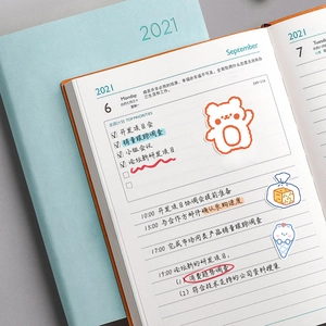 Cute cartoon 2021 daily planner with light blue hard cover and animal illustrated pages