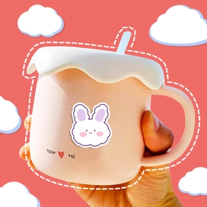 Cute pink rabbit stickers on a pastel coffee mug with cream-shaped lid for journals