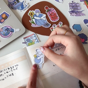 Cute purple theme scrapbooking stickers featuring hand-drawn aesthetic illustrations on a notebook