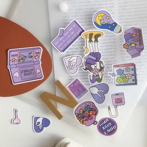 Aesthetic purple stickers featuring retro gaming icons and motivational quotes for journaling
