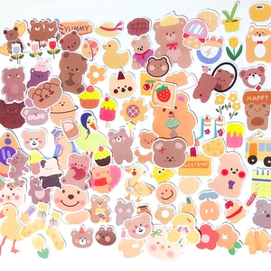 Set of 90 cute cartoon bear stickers for planners, featuring warm cream and yellow tones
