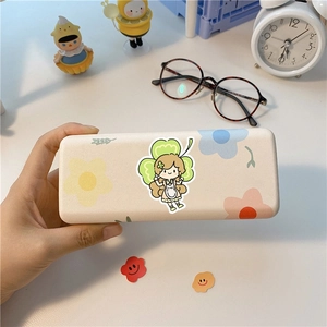 Cream portable eyeglasses case with cute cartoon girl and clover print held by hand