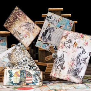 Vintage junk journal scrapbooking paper set with classic European motifs on wood display