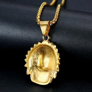 Close-up of matte textured back on gold plated hip-hop chieftain pendant necklace