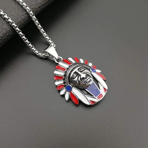 Detail of silver Indian chief pendant with red white and blue enamel and box chain