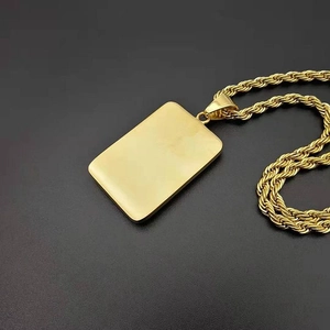 Gold-plated hip hop rectangular pendant necklace with a rope chain on a dark background