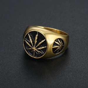 Golden stainless steel signet ring for men featuring a black enamel maple leaf design