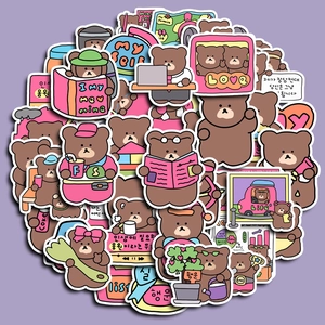 Close-up of waterproof cartoon bear stickers for planners and laptops in vivid colors