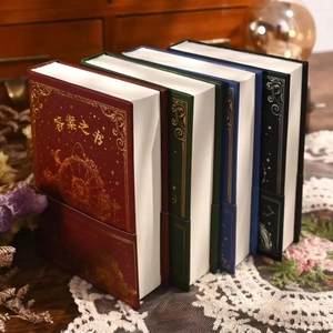 Set of four vintage Answer Books with gold foil stamping and celestial motifs on lace