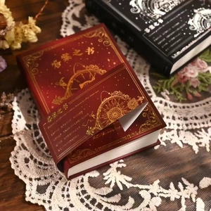Hardcover Book of Answers in black and red with gold foil astrology design