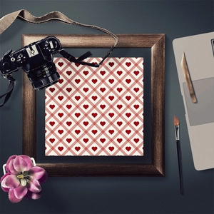 Framed heart pattern decorative art paper in rustic wood frame with art studio props