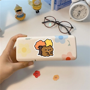 Detailed view of a cute cartoon bear storage case for glasses or stationery accessories