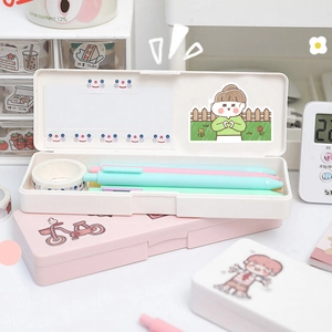 Detail showing cartoon pencil boxes with girl illustrations and spacious interior compartments
