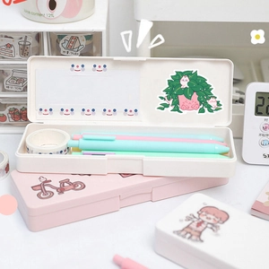 Detailed view of pink and white Korean-style stationery boxes with cute cartoon illustrations