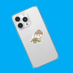 Close-up of a transparent phone case with blue edges and cute cartoon girl sticker