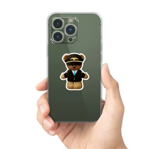 Transparent iPhone case featuring a cute pilot bear print held in hand for display