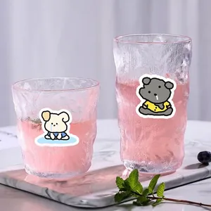 Frosted glass cups with wavy texture and cute bear illustrations in a scenic setting