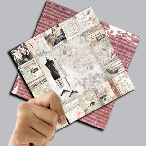 Close-up of vintage collage scrapbook papers featuring ballet and opera art themes