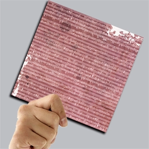 Macro detail of vintage Bauhaus scrapbooking paper with musical score in rusty red