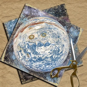 Macro shot of vintage blue starry sky scrapbooking paper with retro golden scissors