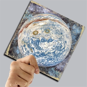 Detailed close-up of celestial planet scrapbooking paper with vintage cracked texture