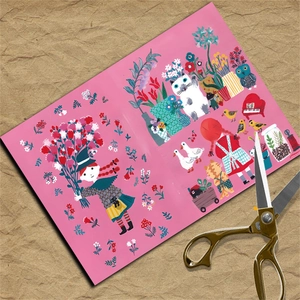 Detail of pink vintage scrapbooking paper with animal and floral illustrations and scissors